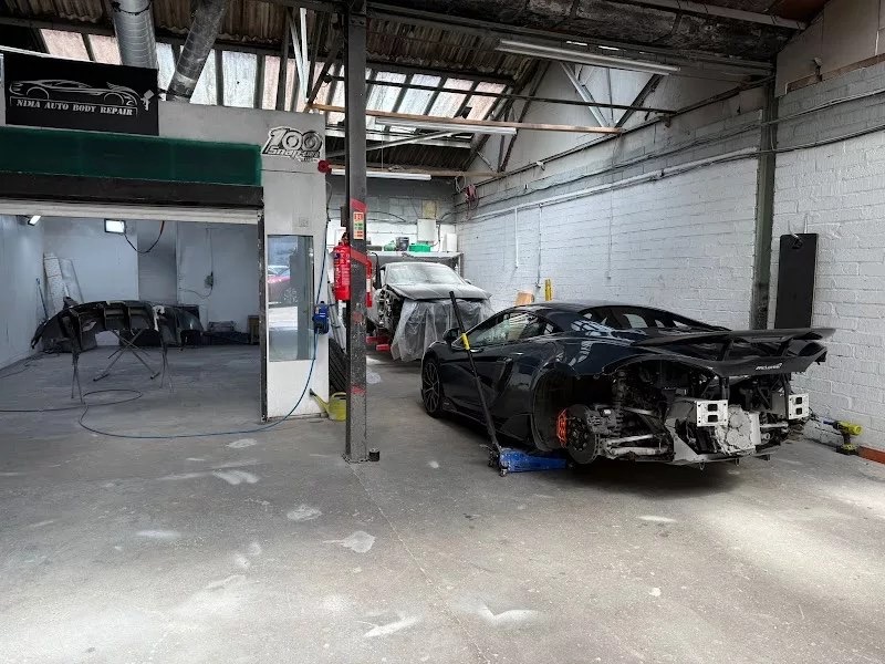 McLaren supercar in rear-end collision repair at Nima Auto Body Repair workshop, Birmingham